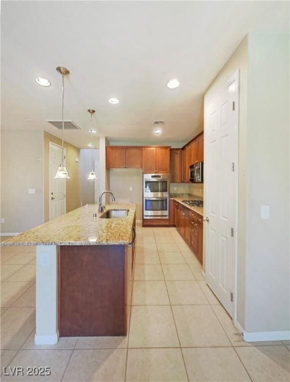10331 Northern Hills Ave, Las Vegas, NV 89166 - kitchen featuring light tile patterned floors, visible vents, appliances with stainless steel finishes, and a sink
