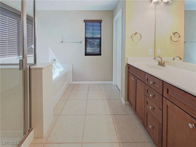 10331 Northern Hills Ave, Las Vegas, NV 89166 - full bath featuring vanity, tile patterned floors, a shower stall, baseboards, and a garden tub