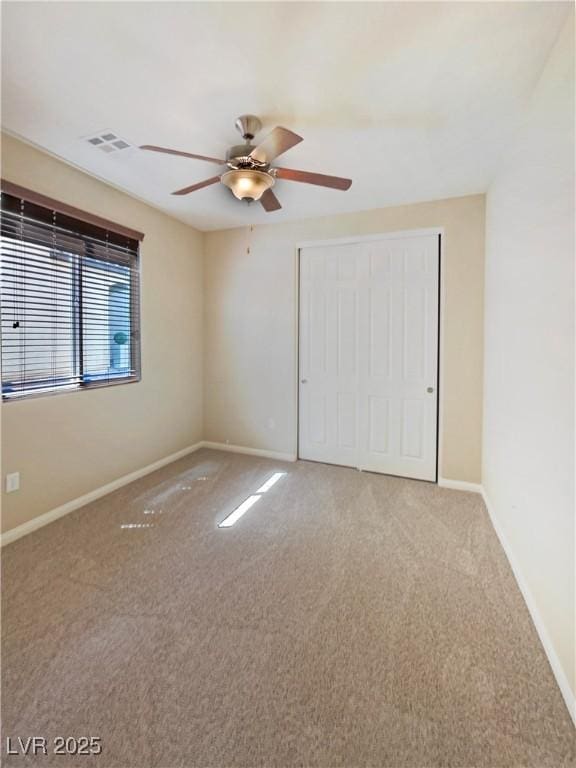 10331 Northern Hills Ave, Las Vegas, NV 89166 - unfurnished bedroom featuring a closet, baseboards, carpet flooring, ceiling fan, and visible vents