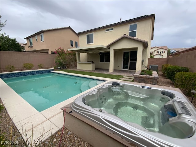 10331 Northern Hills Ave, Las Vegas, NV 89166 - view of pool with a ceiling fan, a hot tub, central AC unit, a fenced backyard, and a fenced in pool