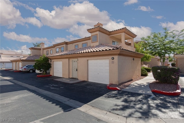 view of front of home featuring stucco siding and a tile roof
