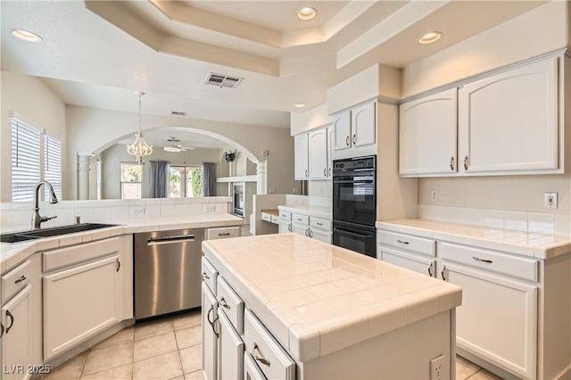 427 Rhythm St, Henderson, NV 89074 - kitchen with a sink, tile counters, and dishwasher