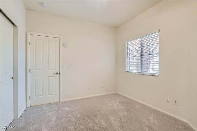 427 Rhythm St, Henderson, NV 89074 - empty room with light carpet and baseboards