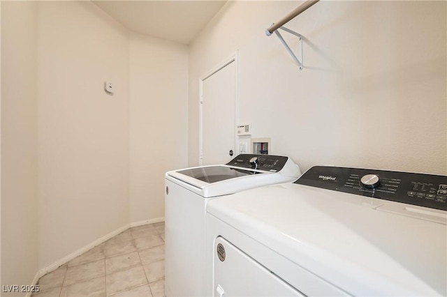 427 Rhythm St, Henderson, NV 89074 - clothes washing area featuring laundry area, baseboards, separate washer and dryer, and light tile patterned floors