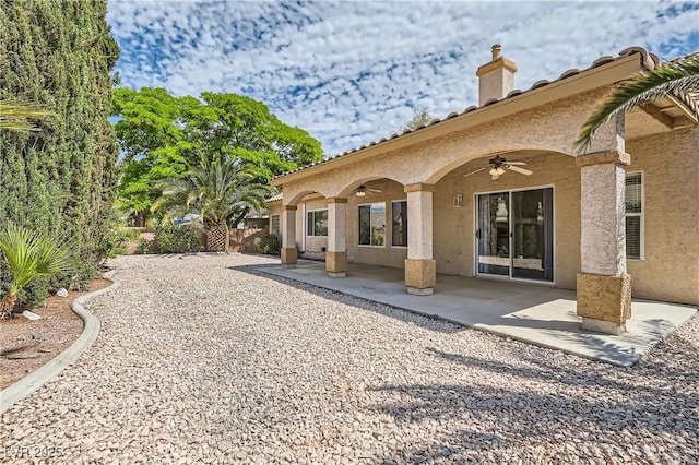 427 Rhythm St, Henderson, NV 89074 - back of house featuring a chimney, fence, a patio, ceiling fan, and stucco siding