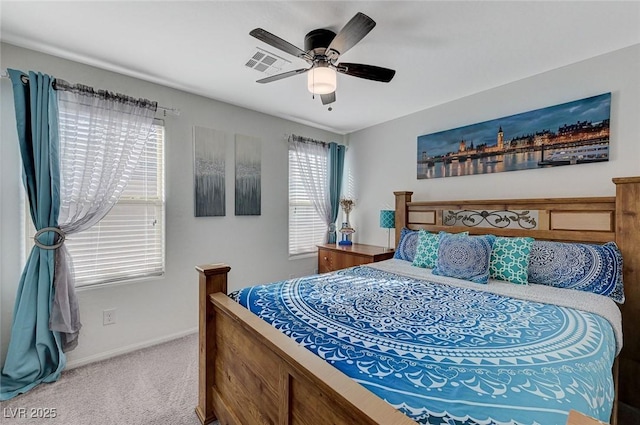 bedroom featuring baseboards, ceiling fan, visible vents, and carpet