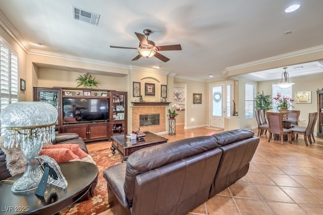 10314 Premia Pl, Las Vegas, NV 89135 - living room with ceiling fan, ornamental molding, light tile patterned floors, and visible vents