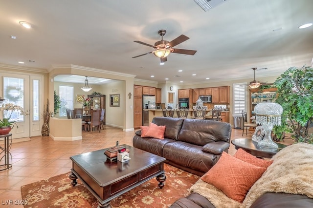 10314 Premia Pl, Las Vegas, NV 89135 - living area with ceiling fan, crown molding, visible vents, and light tile patterned flooring