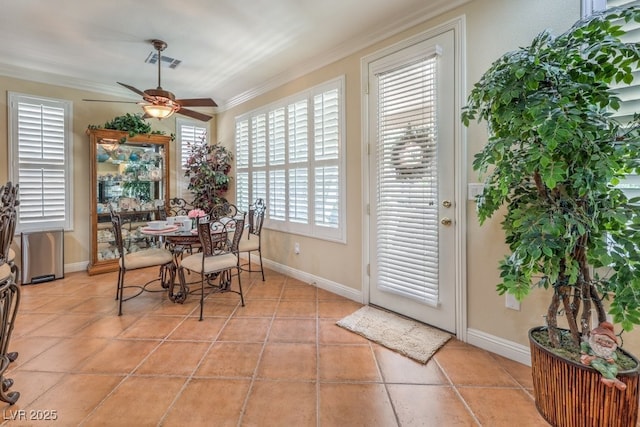 10314 Premia Pl, Las Vegas, NV 89135 - dining space with light tile patterned flooring, visible vents, crown molding, a ceiling fan, and baseboards