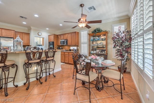 10314 Premia Pl, Las Vegas, NV 89135 - dining space with crown molding, visible vents, ceiling fan, and recessed lighting