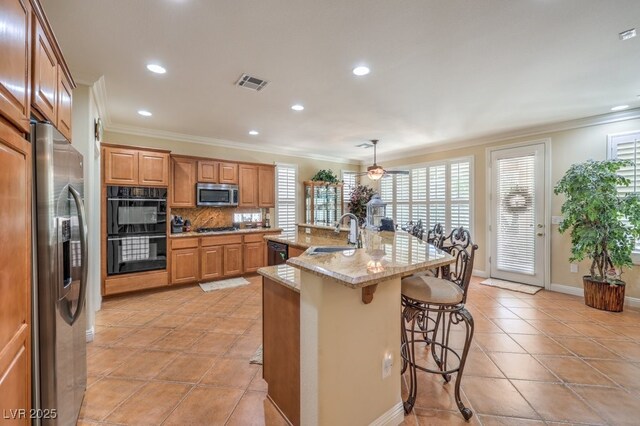 10314 Premia Pl, Las Vegas, NV 89135 - kitchen with recessed lighting, ornamental molding, a sink, black appliances, and tasteful backsplash