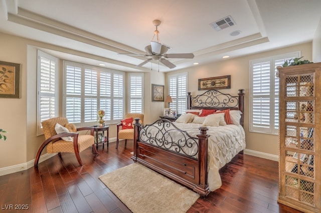 10314 Premia Pl, Las Vegas, NV 89135 - bedroom featuring baseboards, a raised ceiling, dark wood finished floors, and visible vents
