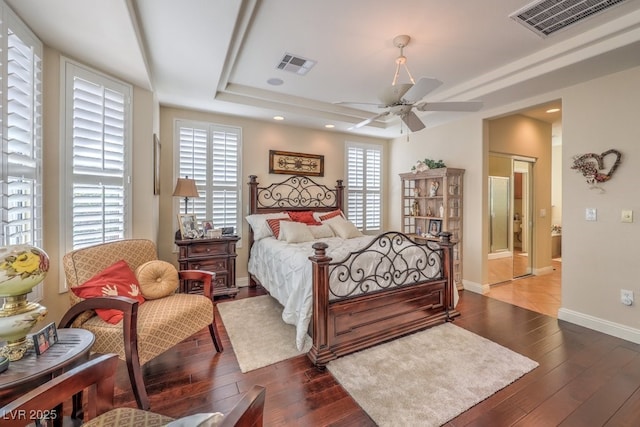 10314 Premia Pl, Las Vegas, NV 89135 - bedroom with visible vents, baseboards, a raised ceiling, and wood-type flooring