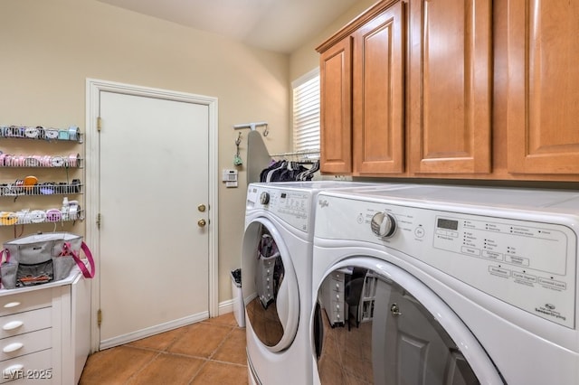 10314 Premia Pl, Las Vegas, NV 89135 - clothes washing area with washing machine and clothes dryer, baseboards, light tile patterned floors, and cabinet space