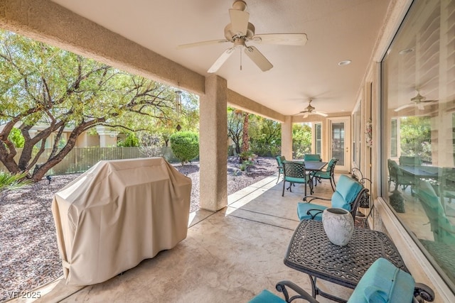 10314 Premia Pl, Las Vegas, NV 89135 - view of patio with a fenced backyard, area for grilling, outdoor dining space, and a ceiling fan