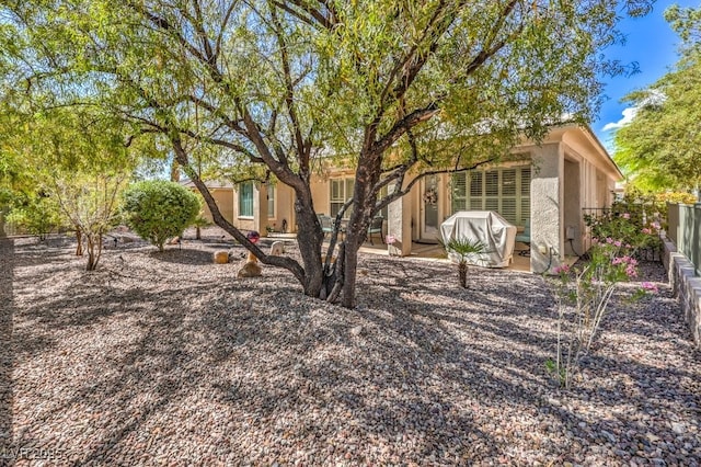 10314 Premia Pl, Las Vegas, NV 89135 - view of front of property featuring stucco siding, fence, and a patio