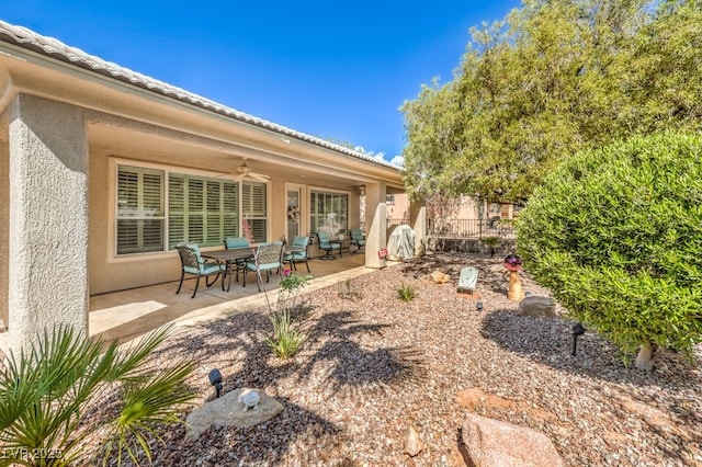 10314 Premia Pl, Las Vegas, NV 89135 - view of yard featuring a patio area, fence, and a ceiling fan