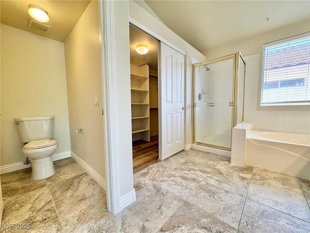 3919 Lilac Haze St, Las Vegas, NV 89147 - full bathroom featuring toilet, visible vents, a shower stall, a walk in closet, and a bath