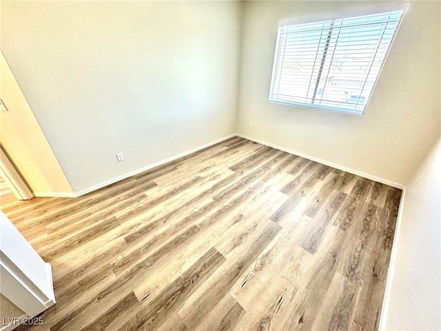 3919 Lilac Haze St, Las Vegas, NV 89147 - spare room with wood finished floors and baseboards