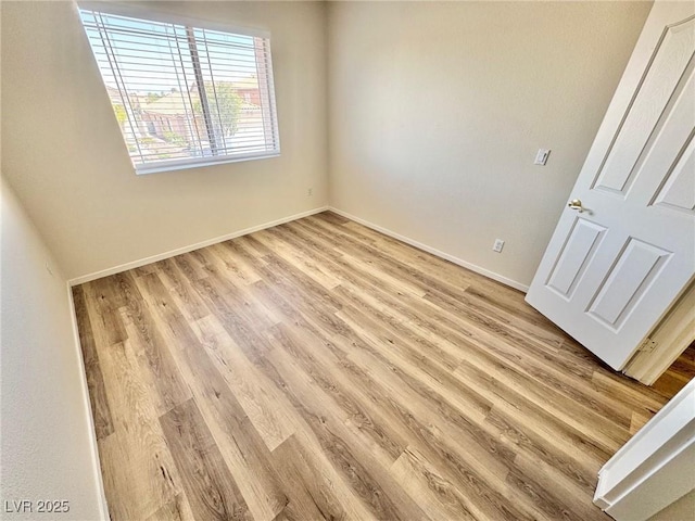 3919 Lilac Haze St, Las Vegas, NV 89147 - empty room featuring baseboards and light wood-style flooring