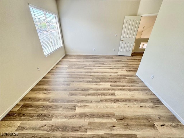 3919 Lilac Haze St, Las Vegas, NV 89147 - spare room with baseboards and wood finished floors