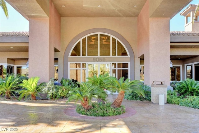 property entrance featuring stucco siding
