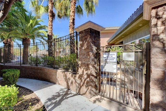 view of gate with fence