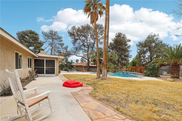 3155 Duneville St, Las Vegas, NV 89146 - view of yard featuring fence, a sunroom, a fenced in pool, and a patio area
