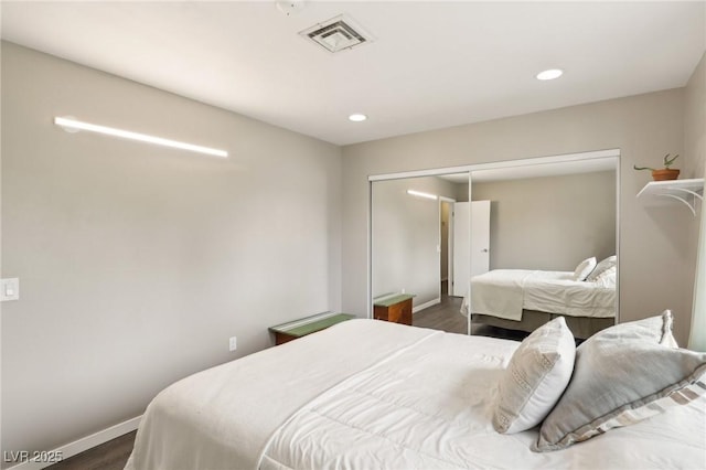 3155 Duneville St, Las Vegas, NV 89146 - bedroom with baseboards, dark wood-style flooring, a closet, and visible vents