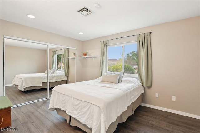 3155 Duneville St, Las Vegas, NV 89146 - bedroom featuring baseboards, a closet, visible vents, and wood finished floors