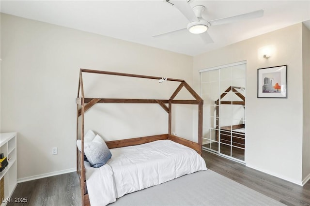 3155 Duneville St, Las Vegas, NV 89146 - bedroom with a closet, wood finished floors, baseboards, and ceiling fan