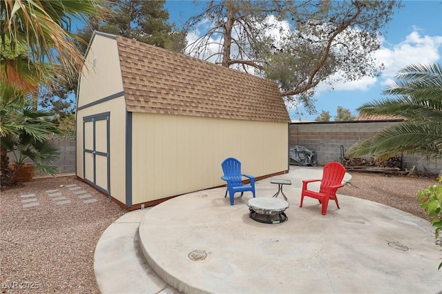 3155 Duneville St, Las Vegas, NV 89146 - view of patio with an outbuilding, a fenced backyard, and a shed