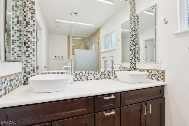 3155 Duneville St, Las Vegas, NV 89146 - bathroom with a stall shower, a sink, and backsplash