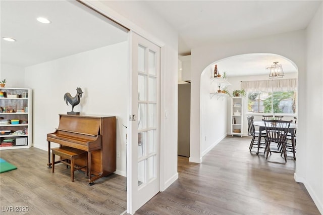 3155 Duneville St, Las Vegas, NV 89146 - hall featuring arched walkways, baseboards, recessed lighting, and wood finished floors