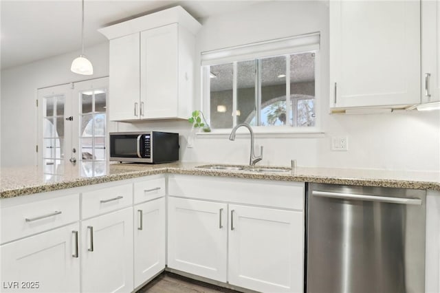 3155 Duneville St, Las Vegas, NV 89146 - kitchen featuring a sink, white cabinetry, a healthy amount of sunlight, and appliances with stainless steel finishes