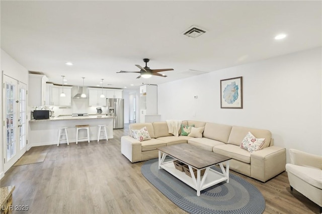 3155 Duneville St, Las Vegas, NV 89146 - living room featuring recessed lighting, ceiling fan, light wood-style flooring, and visible vents