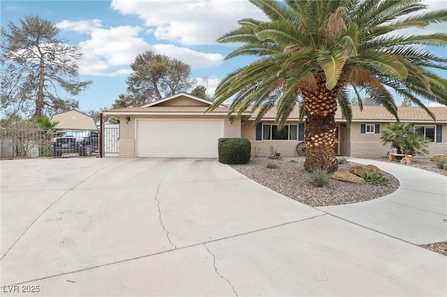 3155 Duneville St, Las Vegas, NV 89146 - ranch-style home featuring a gate, fence, an attached garage, driveway, and stucco siding