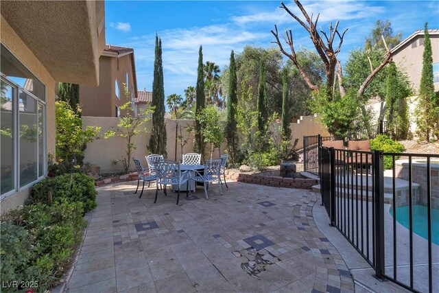 1717 Double Arch Ct, Las Vegas, NV 89128 - view of patio / terrace with a fenced backyard and outdoor dining area