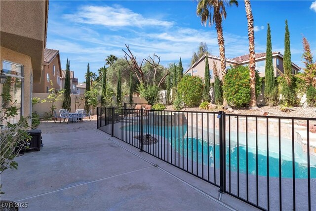 1717 Double Arch Ct, Las Vegas, NV 89128 - exterior space featuring a patio area, a fenced in pool, and a fenced backyard