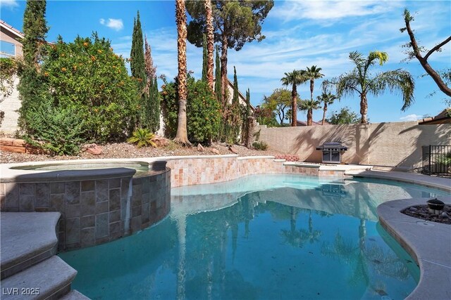 1717 Double Arch Ct, Las Vegas, NV 89128 - view of pool with an in ground hot tub, a fenced in pool, and a fenced backyard