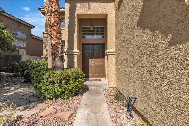 1717 Double Arch Ct, Las Vegas, NV 89128 - view of exterior entry featuring stucco siding