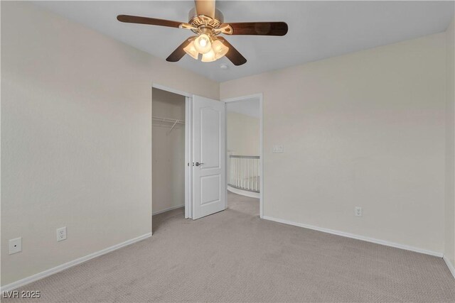 1717 Double Arch Ct, Las Vegas, NV 89128 - unfurnished bedroom with a closet, light carpet, baseboards, and a ceiling fan
