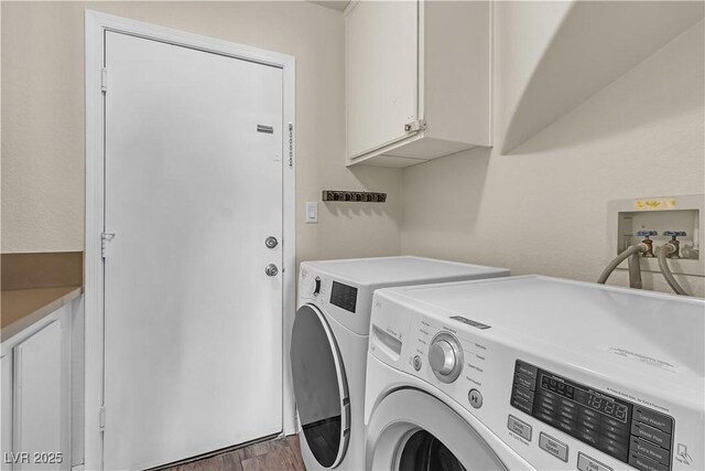 1717 Double Arch Ct, Las Vegas, NV 89128 - washroom with cabinet space, washing machine and clothes dryer, and wood finished floors