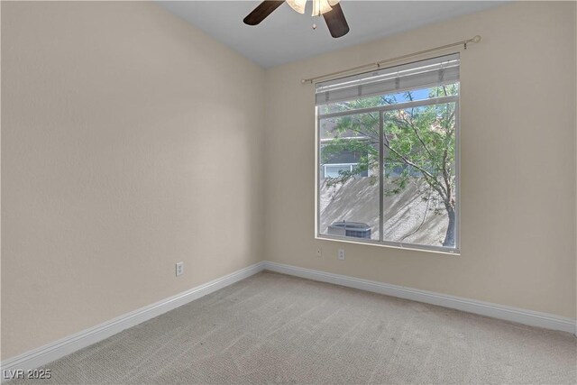 1717 Double Arch Ct, Las Vegas, NV 89128 - unfurnished room with baseboards, light carpet, and ceiling fan