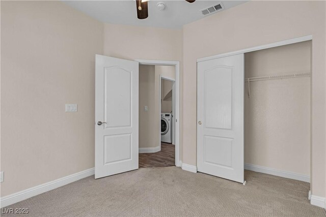 1717 Double Arch Ct, Las Vegas, NV 89128 - unfurnished bedroom featuring carpet flooring, a closet, visible vents, baseboards, and washer / clothes dryer