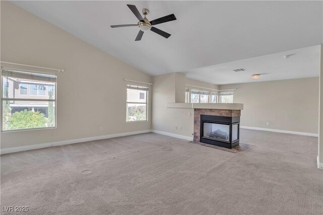 1717 Double Arch Ct, Las Vegas, NV 89128 - unfurnished living room with a tile fireplace, carpet, a ceiling fan, baseboards, and vaulted ceiling