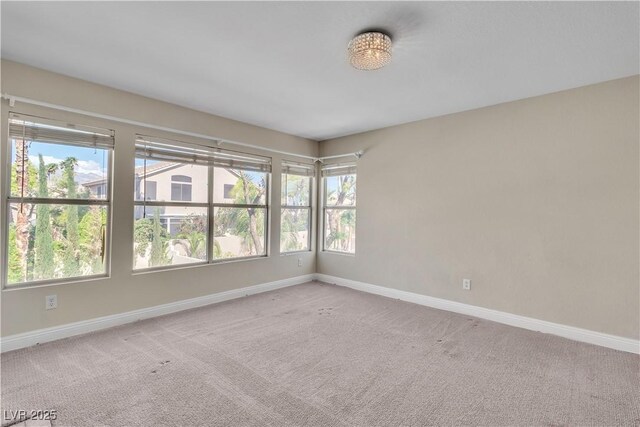1717 Double Arch Ct, Las Vegas, NV 89128 - carpeted empty room featuring baseboards
