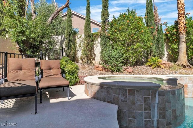 1717 Double Arch Ct, Las Vegas, NV 89128 - view of patio featuring an outdoor hot tub and fence