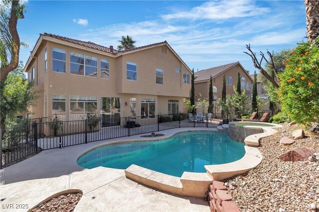 1717 Double Arch Ct, Las Vegas, NV 89128 - view of pool featuring a patio, fence, and a pool with connected hot tub