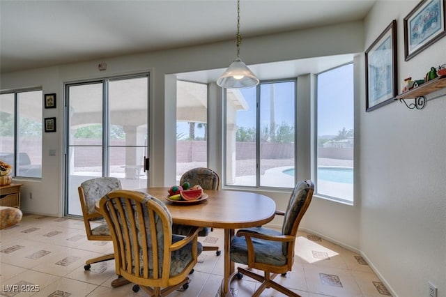 dining area featuring light tile patterned floors